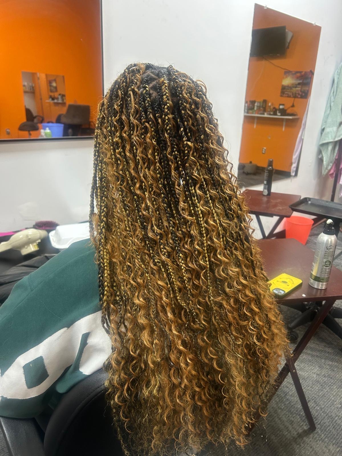 Braiding style by Chidalu African Braids
